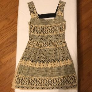 Black and cream colored lace dress